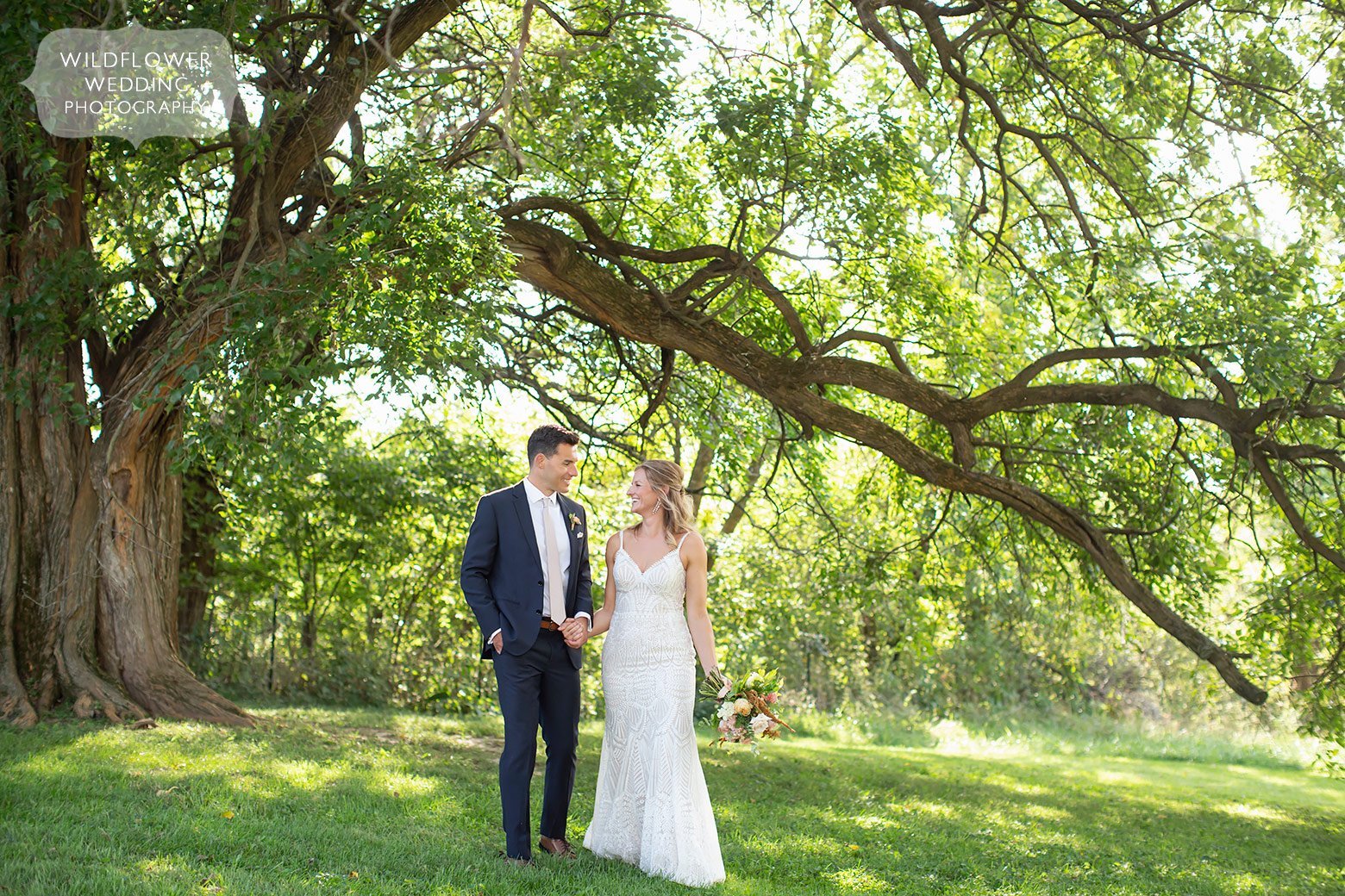Southern wedding photographer captures bride and groom under oak tree.