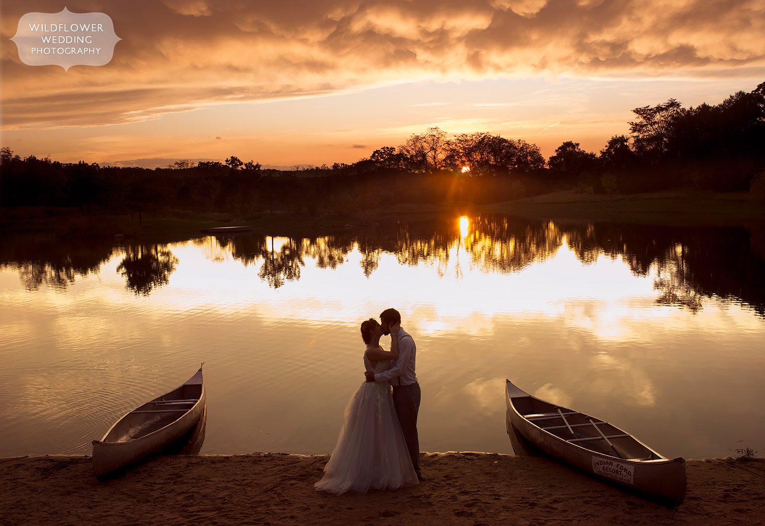 Best wedding photographer in Hermann, Missouri captures bride and groom at sunset by lake in Hermann, MO.