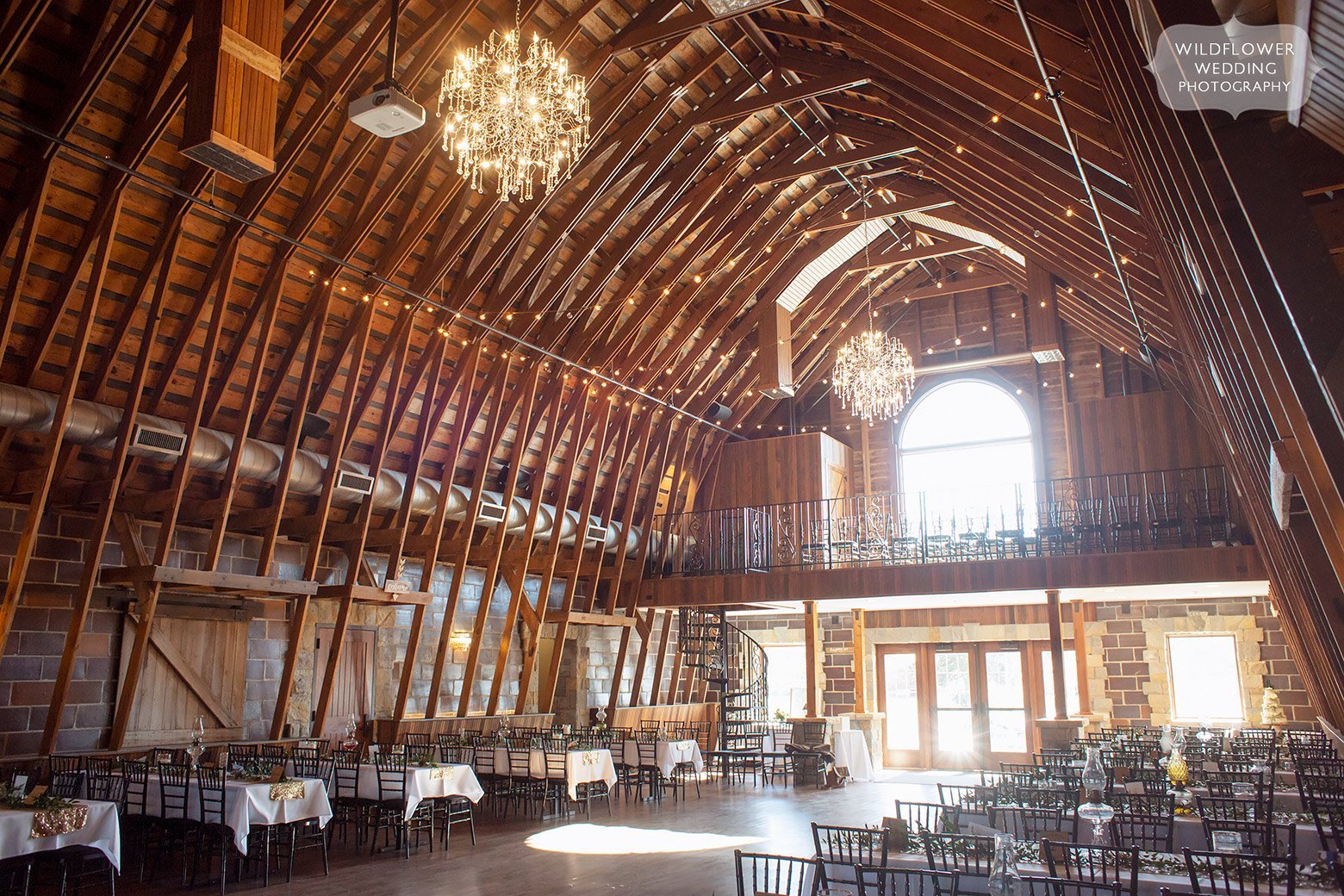 Inside view of the historic Brownstone Barn wedding reception space in Topeka, KS.