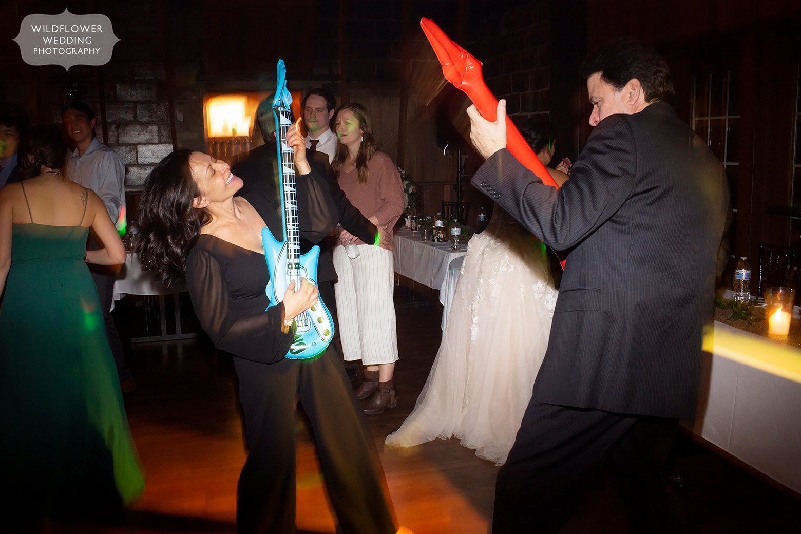 Wedding guests playing fake guitars.