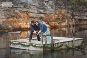 Couple pulls rope in middle of lake at Wildcliff Wedding venue in MO.