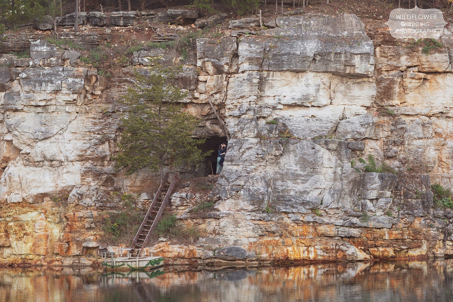 Couple stands in cave at this Missouri quarry lake wedding venue.